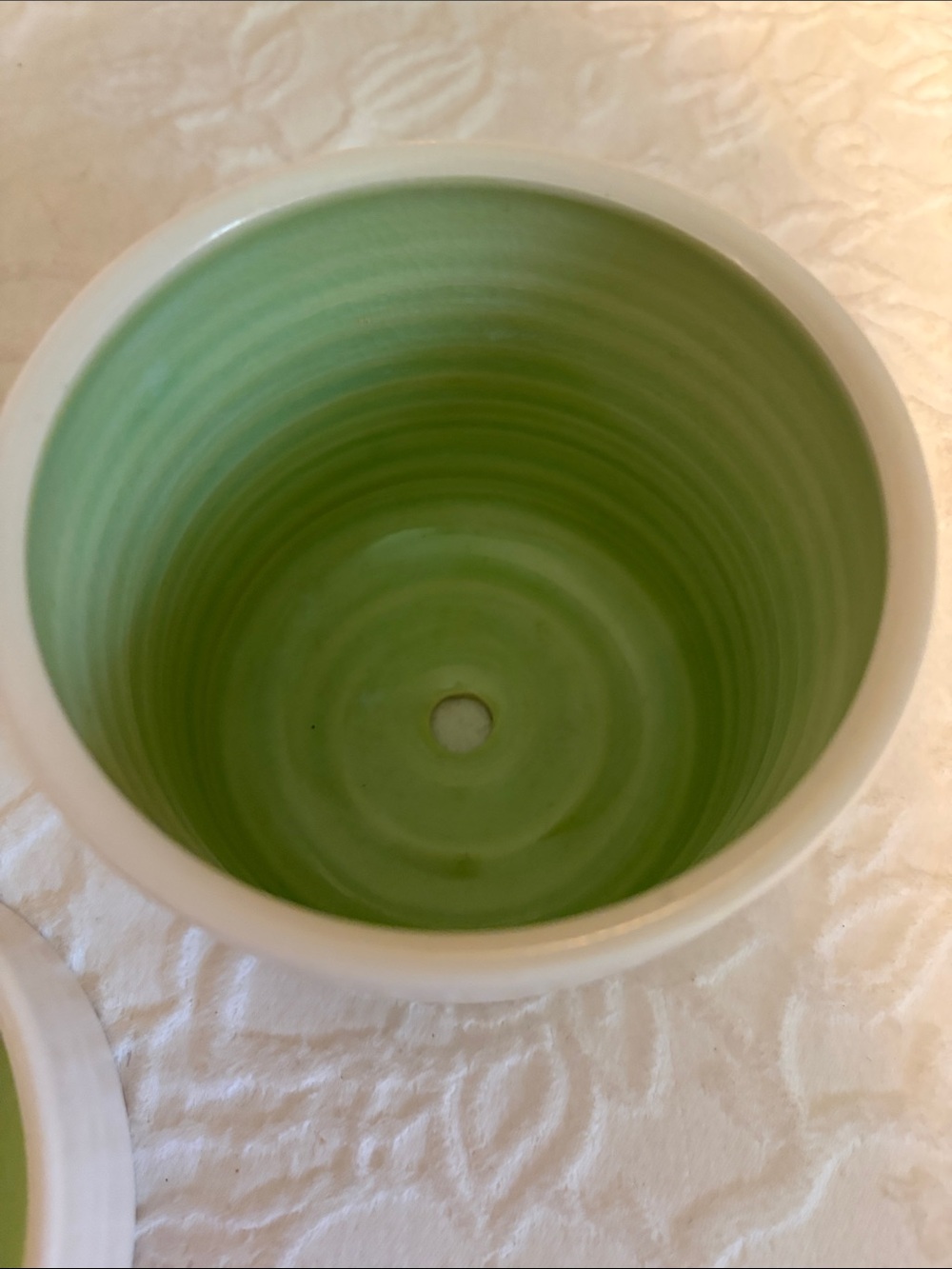 Whimsical White Ceramic Planter with Green Interior and Cactus Motif - Picture 4 of 11